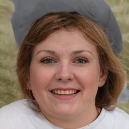 Joyful white young-adult female with medium  brown hair and blue eyes