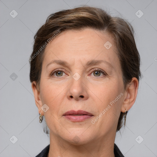 Joyful white adult female with short  brown hair and grey eyes