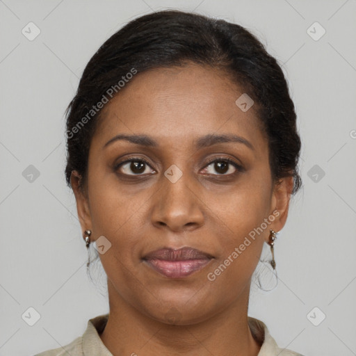 Joyful black adult female with medium  brown hair and brown eyes