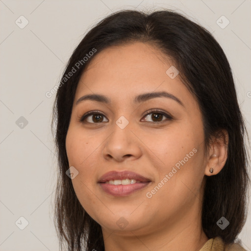 Joyful latino young-adult female with long  brown hair and brown eyes