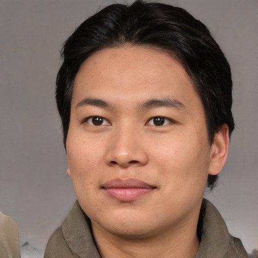 Joyful asian young-adult male with medium  brown hair and brown eyes