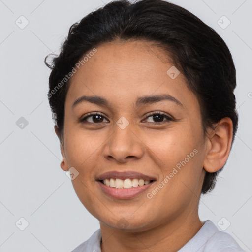 Joyful latino young-adult female with short  brown hair and brown eyes