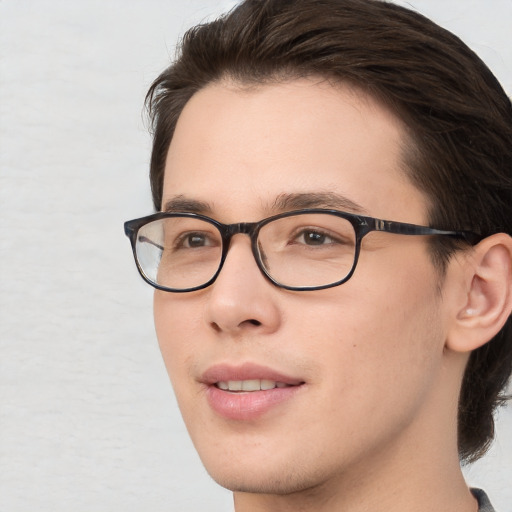 Joyful white young-adult male with medium  brown hair and brown eyes