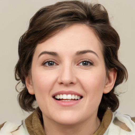 Joyful white young-adult female with medium  brown hair and green eyes