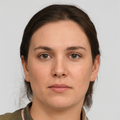 Neutral white young-adult female with medium  brown hair and grey eyes