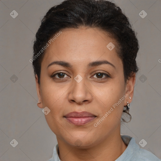 Joyful latino adult female with short  brown hair and brown eyes