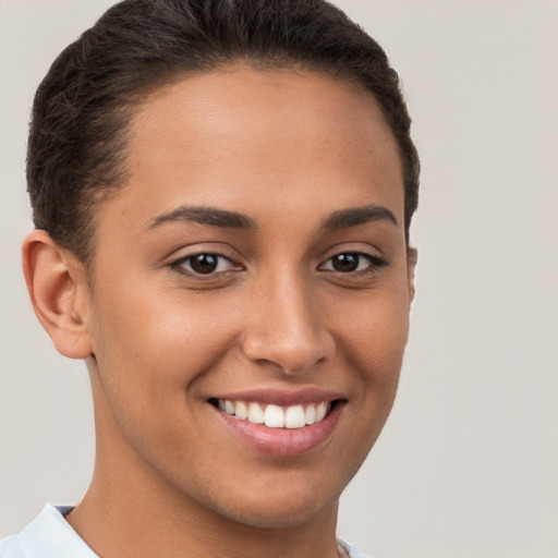 Joyful white young-adult female with short  brown hair and brown eyes