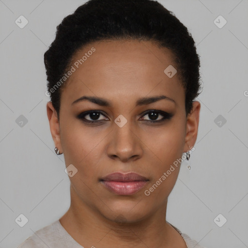 Joyful black young-adult female with short  black hair and brown eyes