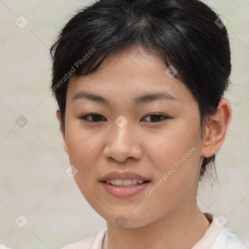 Joyful asian young-adult female with short  brown hair and brown eyes