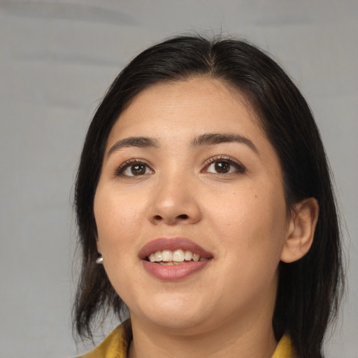 Joyful asian young-adult female with medium  brown hair and brown eyes