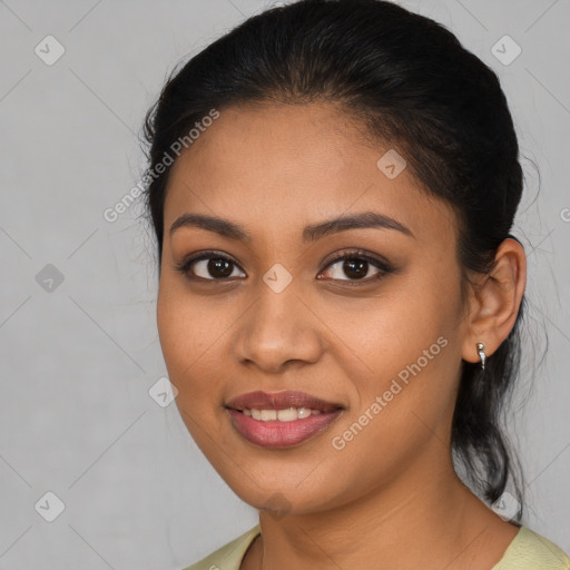 Joyful latino young-adult female with medium  brown hair and brown eyes