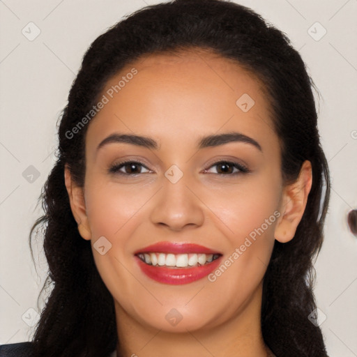 Joyful latino young-adult female with long  black hair and brown eyes