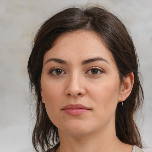 Joyful white young-adult female with medium  brown hair and brown eyes