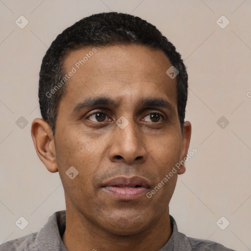 Neutral latino adult male with short  black hair and brown eyes