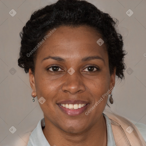 Joyful black adult female with short  brown hair and brown eyes