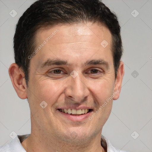 Joyful white adult male with short  brown hair and brown eyes