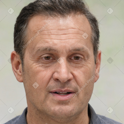 Joyful white middle-aged male with short  brown hair and brown eyes