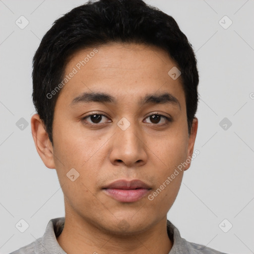 Neutral latino young-adult male with short  black hair and brown eyes