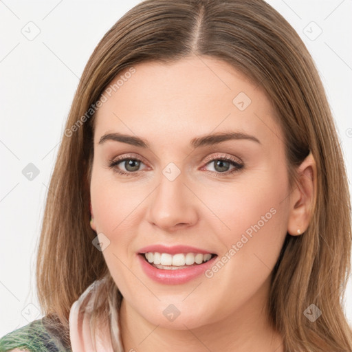 Joyful white young-adult female with medium  brown hair and green eyes