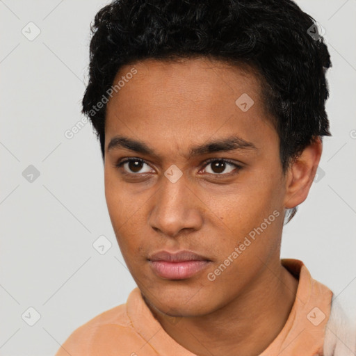 Neutral latino young-adult male with short  black hair and brown eyes