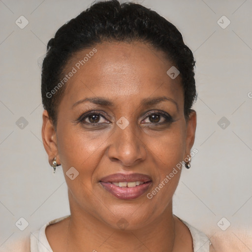 Joyful black adult female with short  brown hair and brown eyes