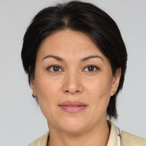 Joyful white adult female with medium  brown hair and brown eyes