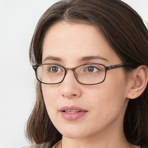 Neutral white young-adult female with long  brown hair and brown eyes