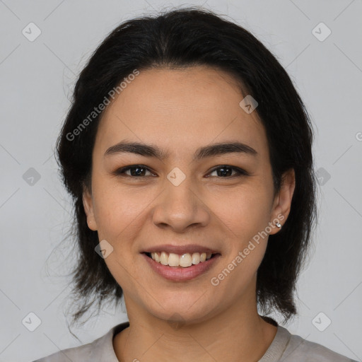 Joyful latino young-adult female with medium  brown hair and brown eyes