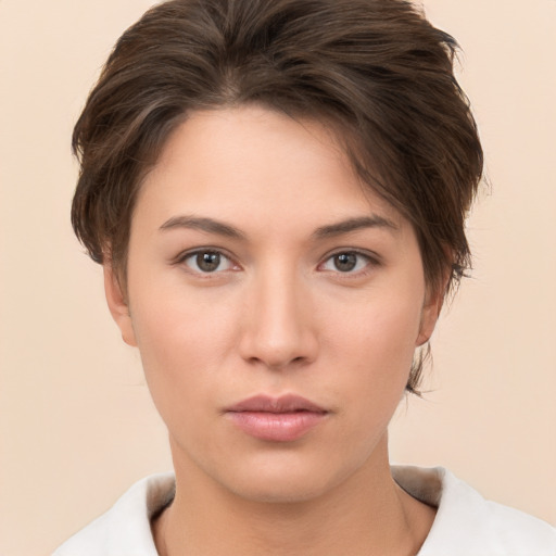 Neutral white young-adult female with short  brown hair and brown eyes