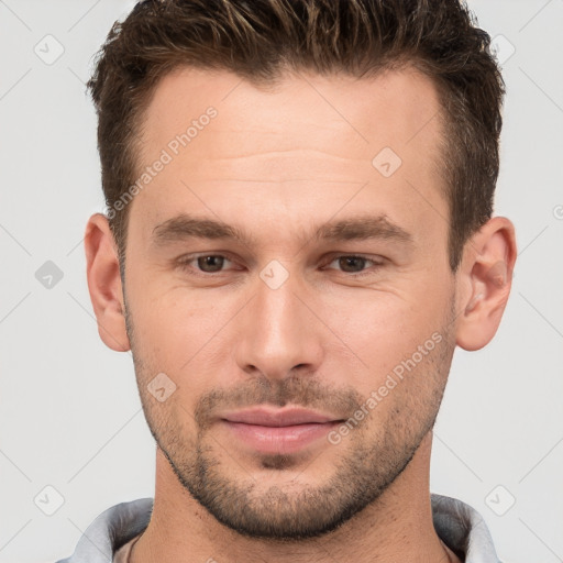 Joyful white young-adult male with short  brown hair and brown eyes