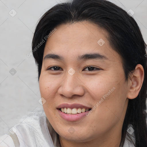 Joyful asian young-adult female with medium  brown hair and brown eyes