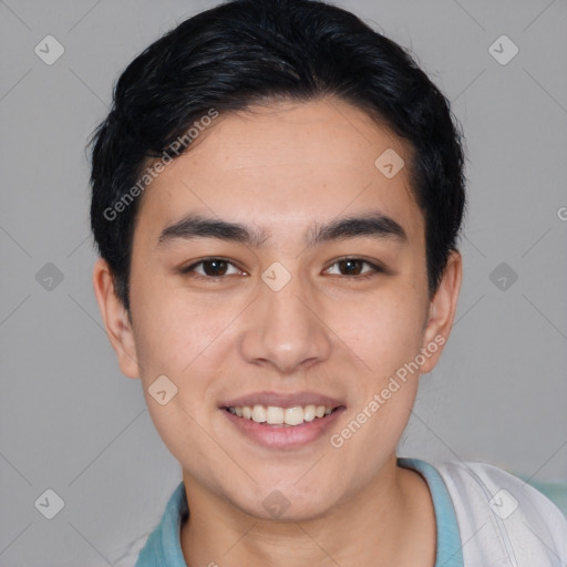 Joyful white young-adult male with short  black hair and brown eyes