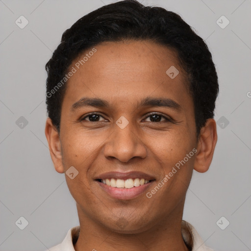 Joyful latino young-adult male with short  black hair and brown eyes