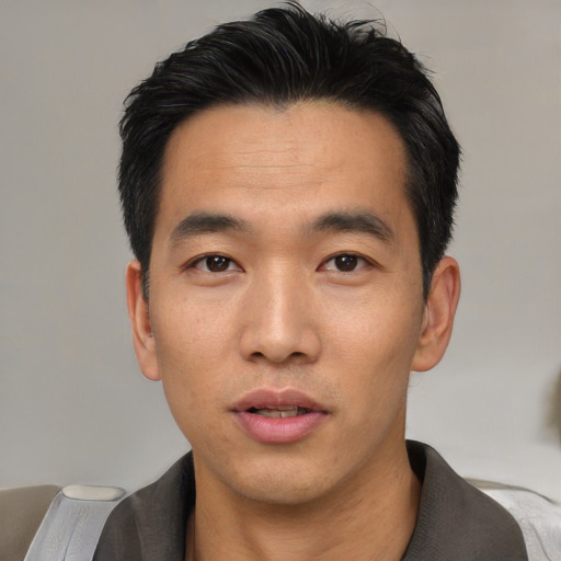 Neutral asian young-adult male with short  black hair and brown eyes