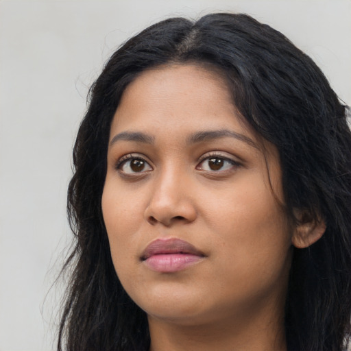 Neutral latino young-adult female with long  black hair and brown eyes