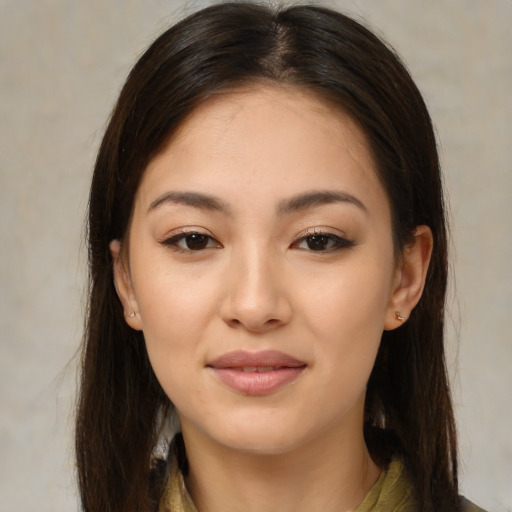 Joyful asian young-adult female with medium  brown hair and brown eyes