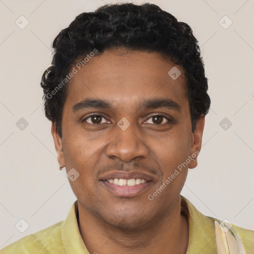 Joyful black young-adult male with short  black hair and brown eyes