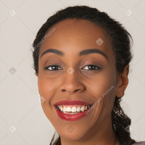 Joyful latino young-adult female with long  brown hair and brown eyes