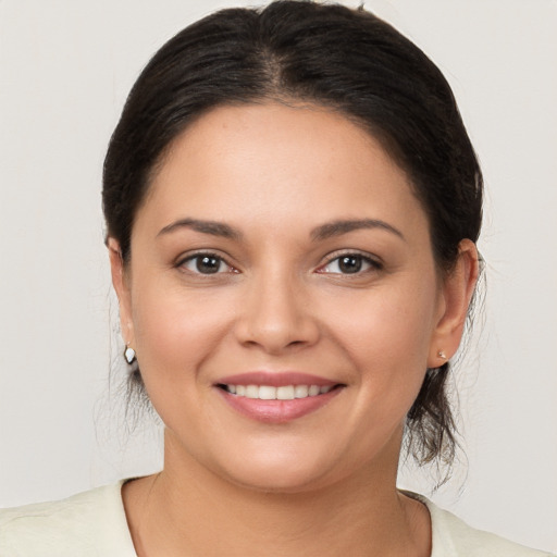 Joyful white young-adult female with medium  brown hair and brown eyes