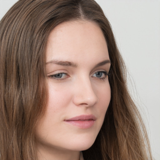 Neutral white young-adult female with long  brown hair and grey eyes