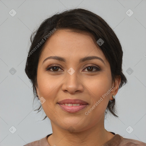 Joyful latino young-adult female with medium  brown hair and brown eyes