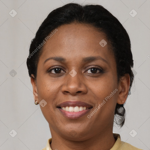 Joyful black young-adult female with short  brown hair and brown eyes