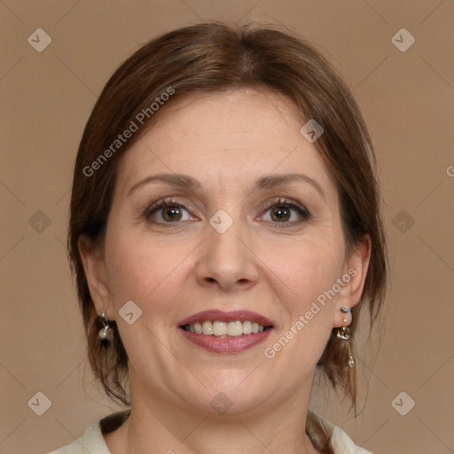 Joyful white adult female with medium  brown hair and brown eyes