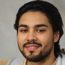 Joyful latino young-adult male with short  black hair and brown eyes