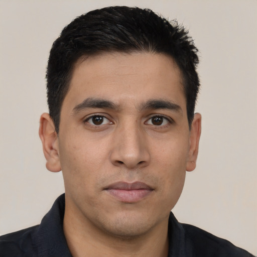 Joyful asian young-adult male with short  black hair and brown eyes