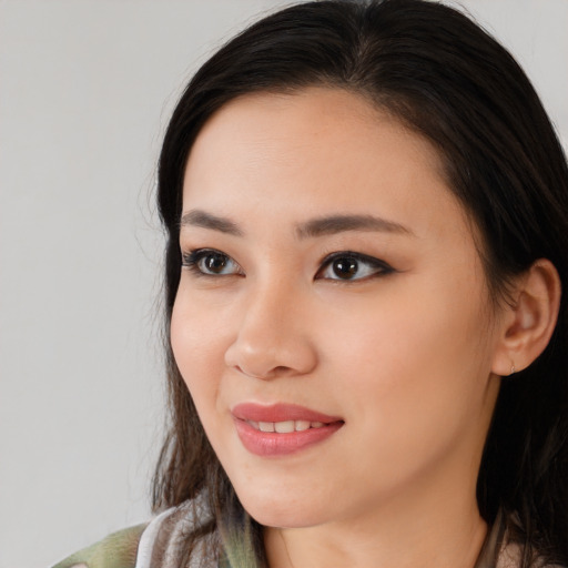 Joyful white young-adult female with medium  black hair and brown eyes