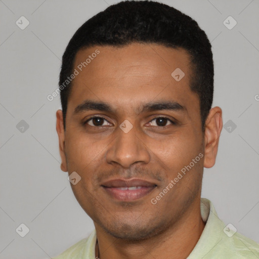 Joyful black young-adult male with short  black hair and brown eyes