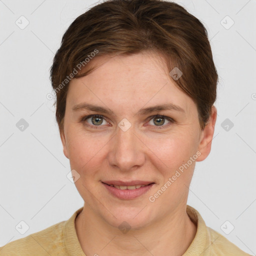 Joyful white young-adult female with short  brown hair and grey eyes