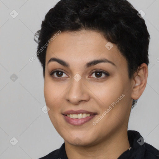 Joyful latino young-adult female with short  black hair and brown eyes