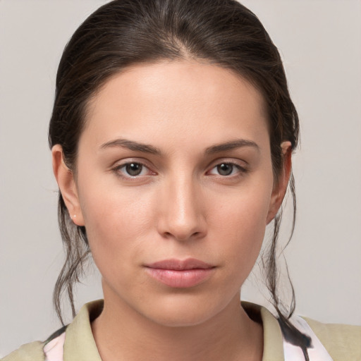 Neutral white young-adult female with medium  brown hair and brown eyes